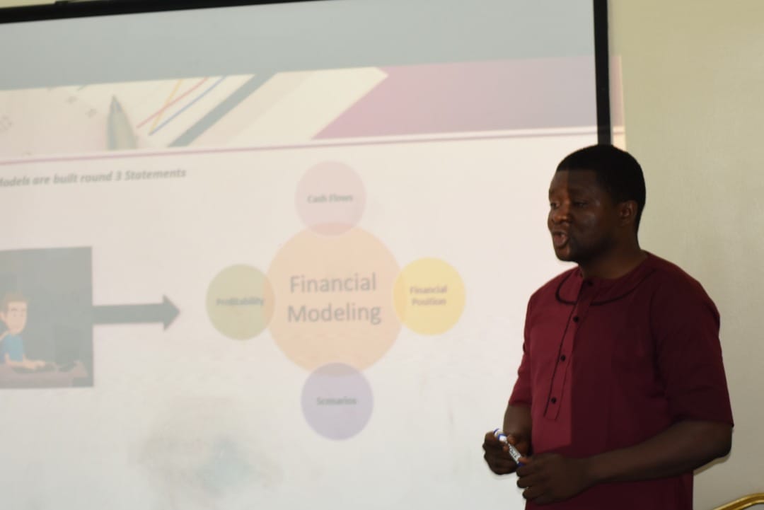 Trainer explaining how financial models are built around three statements